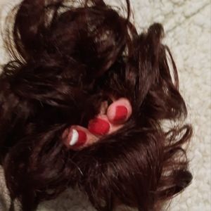Dark burgundy messy hair bun